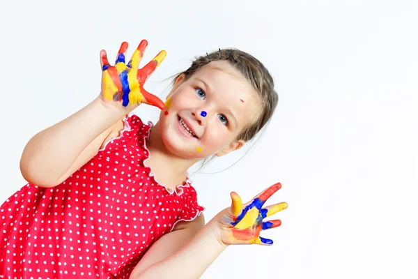 Criança feliz com tinta nas mãos — Fotografia de Stock