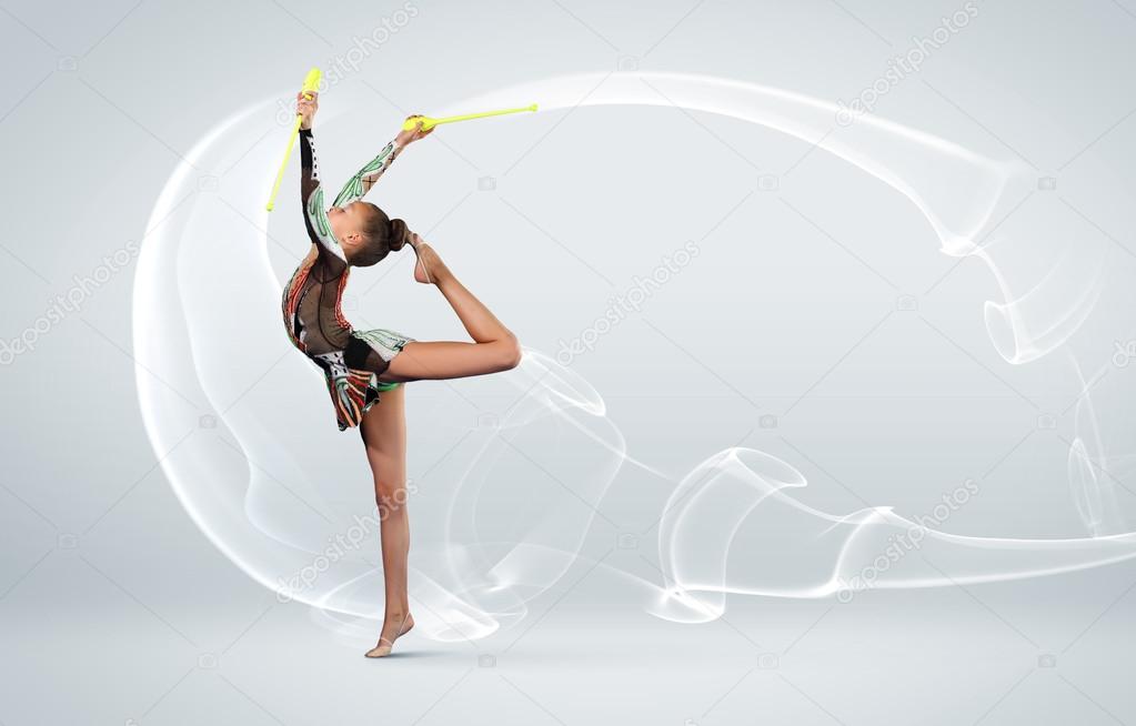 Young woman in gymnast suit posing