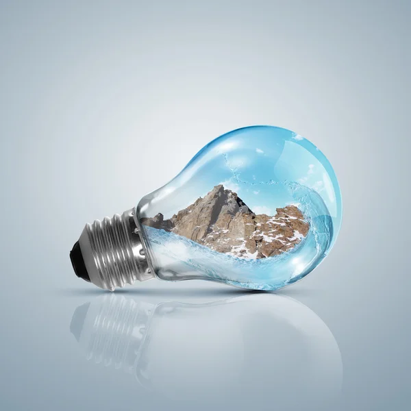 Lamp bulb with clean nature symbol inside — Stock Photo, Image