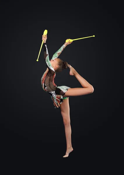 Jonge vrouw in gymnast pak poseren — Stockfoto