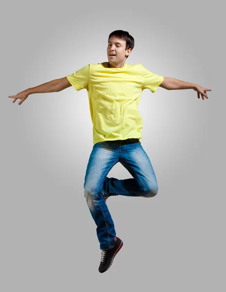 Young man dancing and jumping — Stock Photo, Image