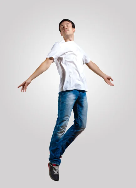 Young man dancing and jumping — Stock Photo, Image