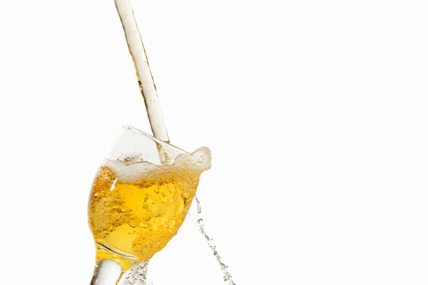 White wine pouring into glass — Stock Photo, Image