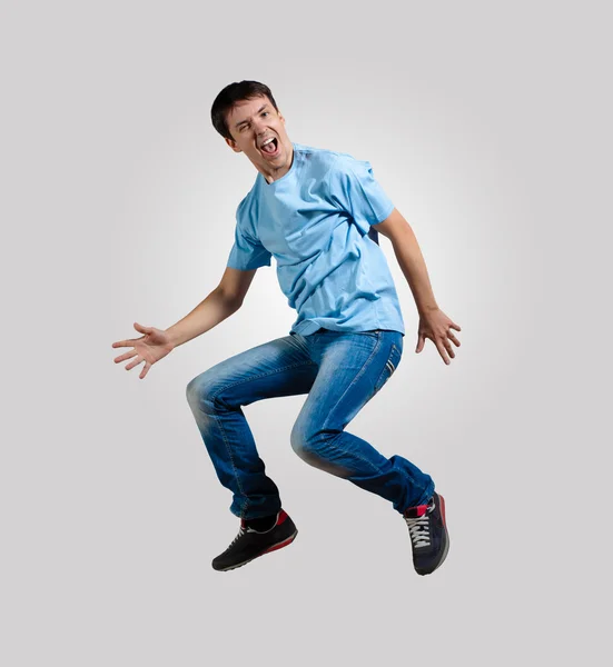 Young man dancing and jumping — Stock Photo, Image