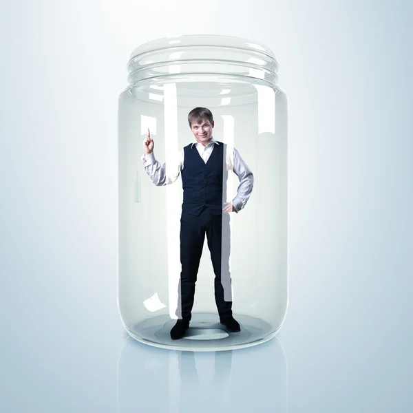 Empresario dentro del frasco de vidrio — Foto de Stock