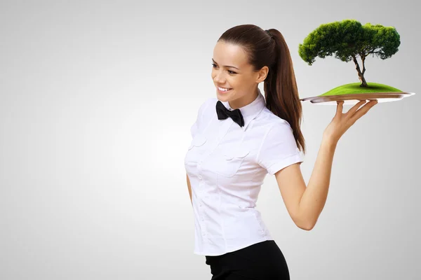 Waitress with a tray with green symbol on it — Stock Photo, Image