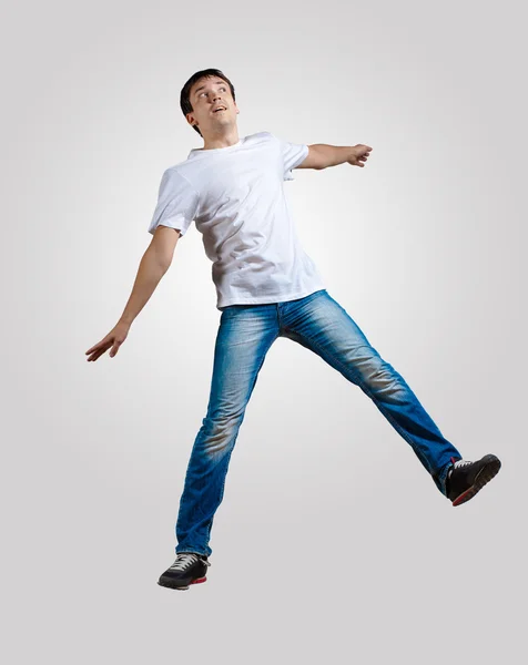 Young man dancing and jumping — Stock Photo, Image