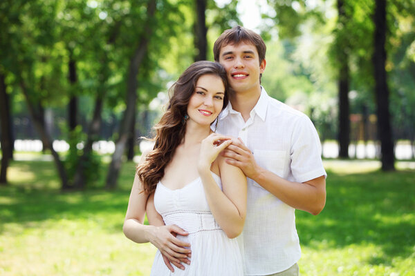 Young love Couple smiling under blue sky