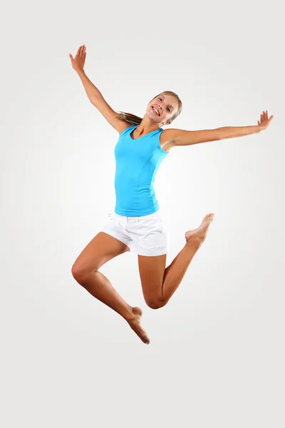 Fitness woman jumping excited — Stock Photo, Image