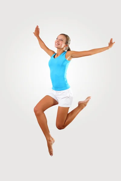 Fitness woman jumping excited — Stock Photo, Image