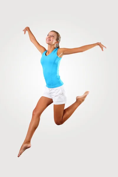 Fitness woman jumping excited Stock Photo