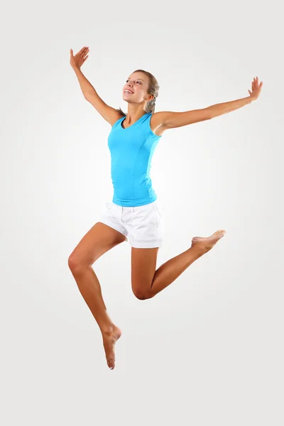 Fitness woman jumping excited Stock Image