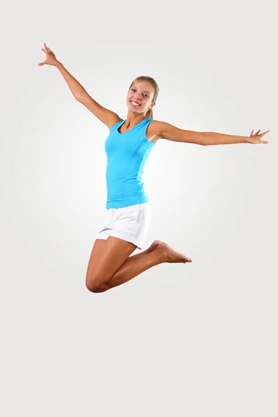 Fitness woman jumping excited Royalty Free Stock Photos