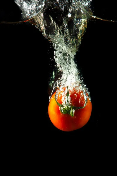 Fresh tomato under water — Stock Photo, Image