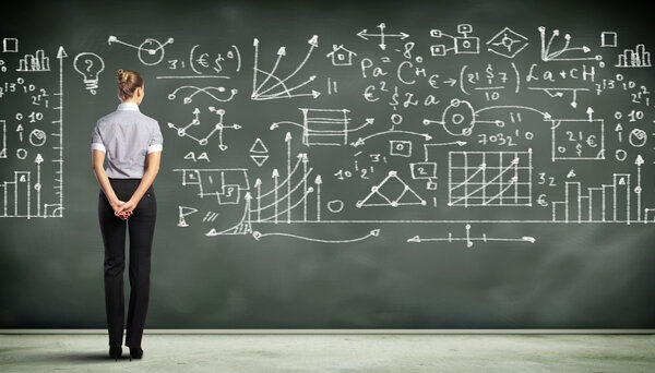 Business person against the blackboard