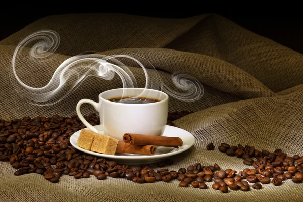 Coffee beans and white cup — Stock Photo, Image