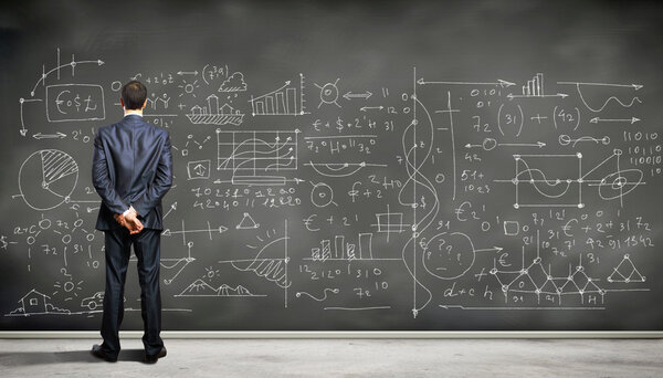 Business person against the blackboard