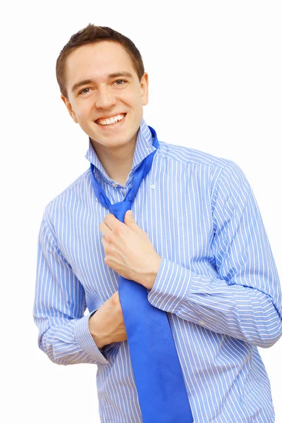 Businessman at home making his tie — Stock Photo, Image