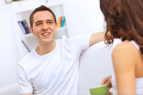 Young happy couple at hone together s — Stock Photo, Image