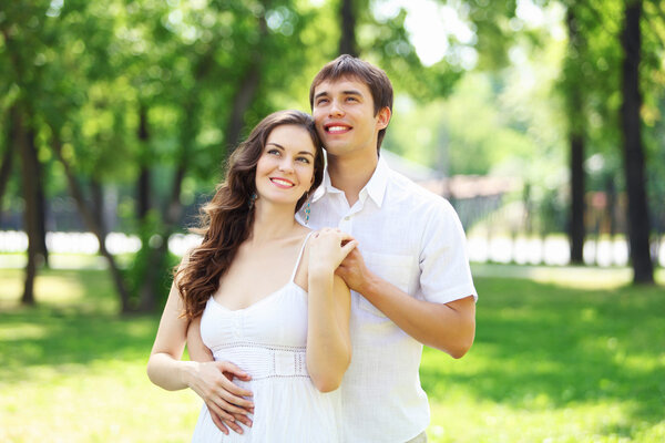 Young love Couple smiling under blue sky