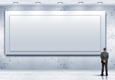 bir boş billboard-duran iş kişi