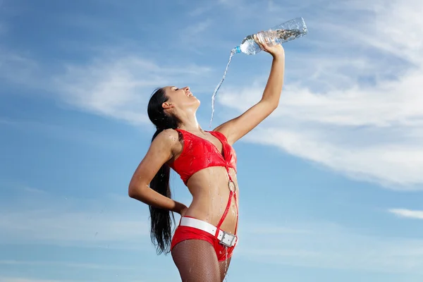 Young female sport girl with a bottle of water — Stock Photo, Image