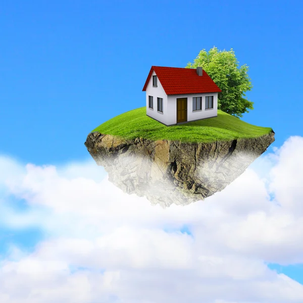 Een stuk land in de lucht met huis en boom. — Stockfoto