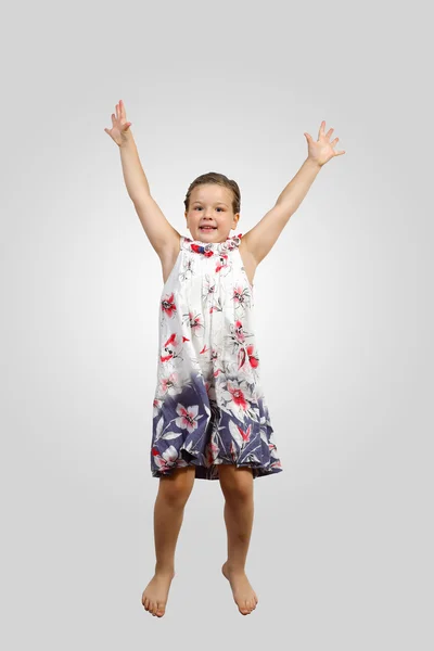 Glückliches Kind springen — Stockfoto
