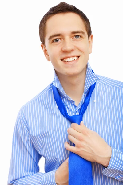 Businessman at home making his tie — Stock Photo, Image