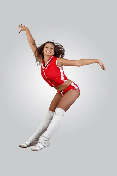 Unga kvinnliga dansare mot vit bakgrund — Stockfoto
