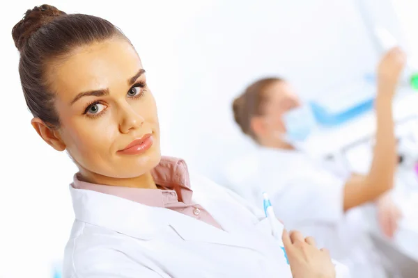 Team of scientists working in laboratory — Stock Photo, Image