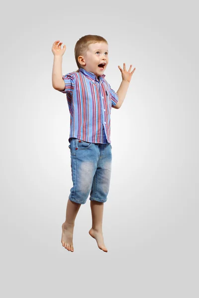 Happy kid jumping Stock Picture