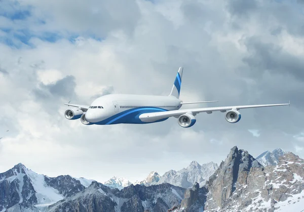 White passenger plane above the mountains — Stock Photo, Image