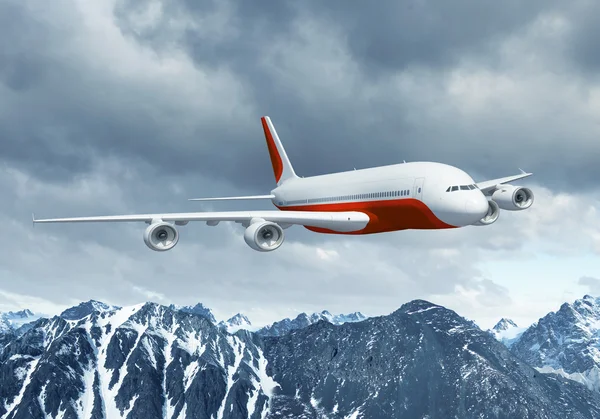 Dağların üstünde beyaz yolcu uçağı — Stok fotoğraf