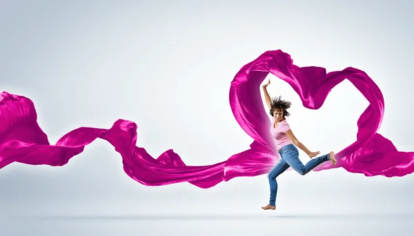 Dancing young woman with flying fabric — Stock Photo, Image