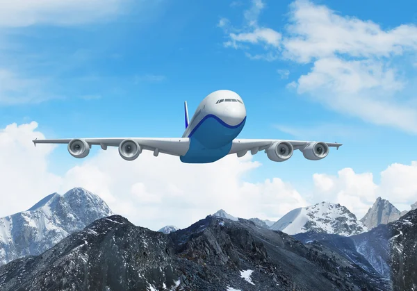 White passenger plane above the mountains — Stock Photo, Image