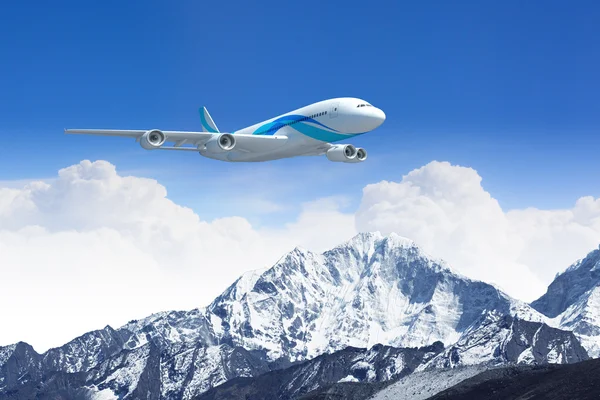 White passenger plane above the mountains — Stock Photo, Image