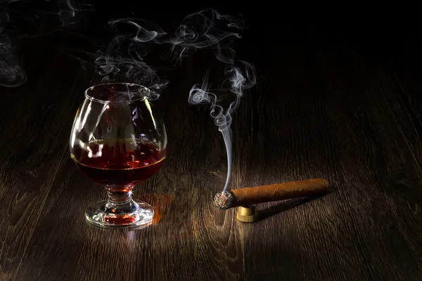 Image with a glass of cognac and cigar — Stock Photo, Image