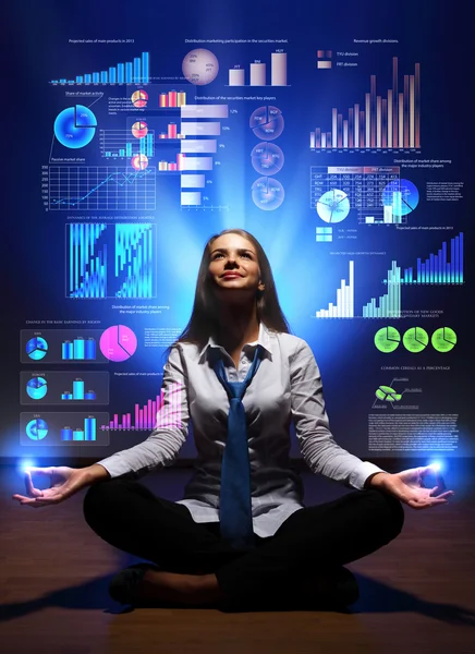 Business woman with financial symbols around — Stock Photo, Image