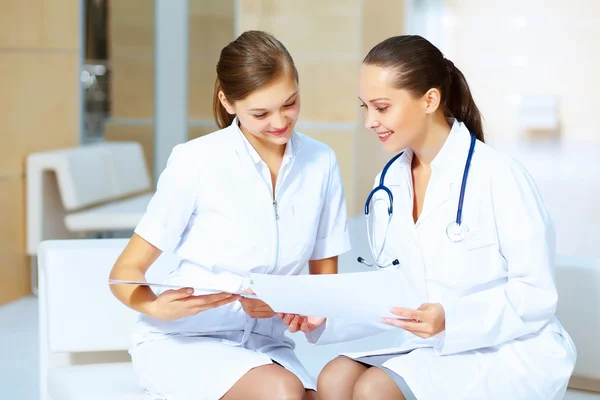 Portrait of two friendly female doctors — Stock Photo, Image