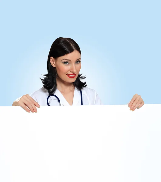 Young female doctor with a banner — Stock Photo, Image