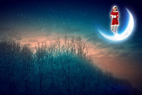 Photo of santa claus sitting on the moon — Stock Photo, Image