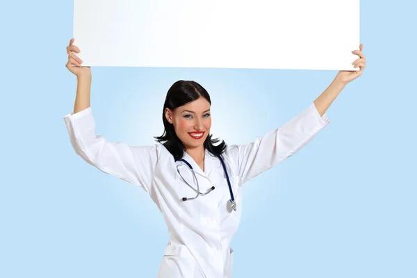 Young female doctor with a banner — Stock Photo, Image