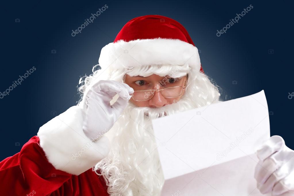 Santa claus reading a letter