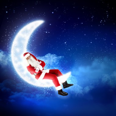 Ay'da oturup Noel Baba'nın fotoğraf