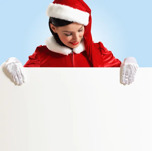 Santa ragazza con un banner vuoto — Foto Stock