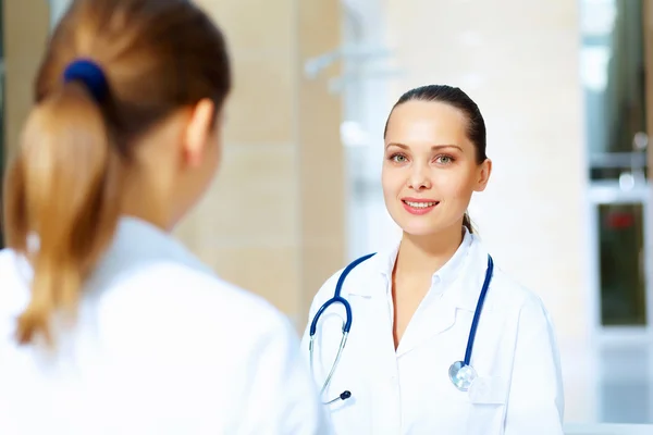 Portrait of two friendly female doctors — Stock Photo, Image