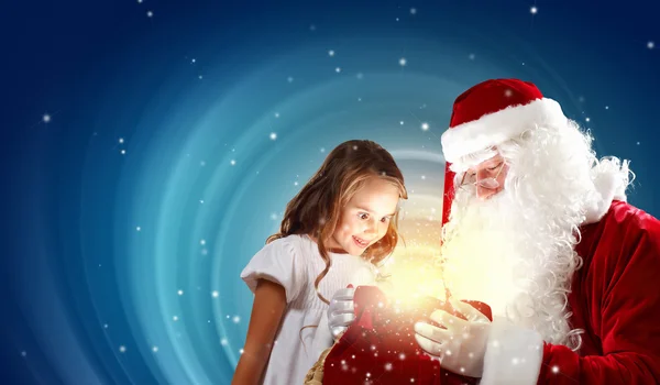 Portret van de kerstman met een meisje Stockfoto