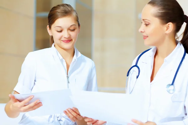 Portrait of two friendly female doctors Royalty Free Stock Photos