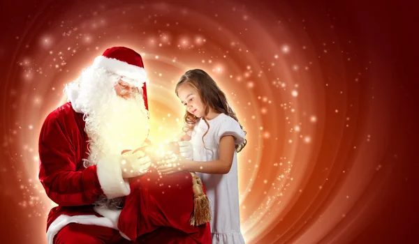 Retrato de santa claus con una chica Imagen de stock